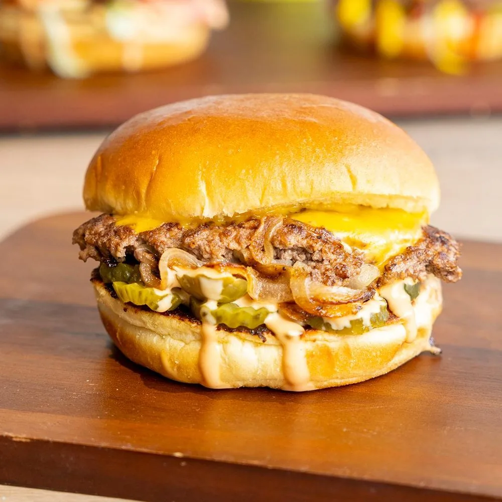 Oklahoma smash beef burger with onions smashed into the patty